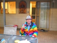 P5220670  Cheers, Rauleigh enjoying a rose on the deck at Bear's Den, Denmark.