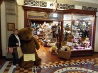 DSCF7190  Sam cuddles a teddy outside The Teddy Bear Shop, Regent Arcade, Adelaide.