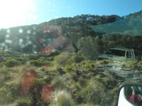 P5040117  Interesting photo of Sam taking a photo out the window of the Motor home. Sam's reflections in the mirror and in the window with a trailing vehicle to boot.