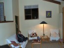 04290024 * Sam in the lounge room of Kakapu Cottage. * 2240 x 1680 * (464KB)