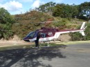 04280004 * Helicopter loading a baby into the passenger's seat - blades were spinning just before takeoff in the middle of Paihia. * 2240 x 1680 * (1.18MB)